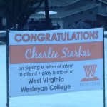 Charlie's signing banner